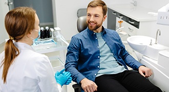 A male patient chatting with his dentist